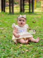 Load image into Gallery viewer, Yellow Baby girl Smocked romper. Hand embroidered with Hair Bow